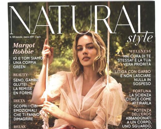 Elegant cover with a natural, serene vibe, delicate dress, and forest backdrop.